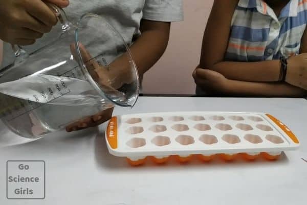 Pour water in ice tray