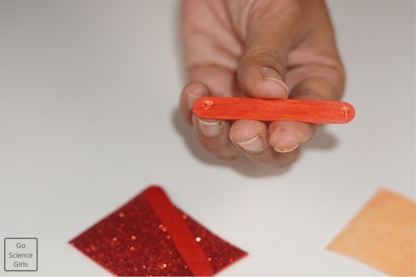 Paste Red popsicle Stick On Sand Paper