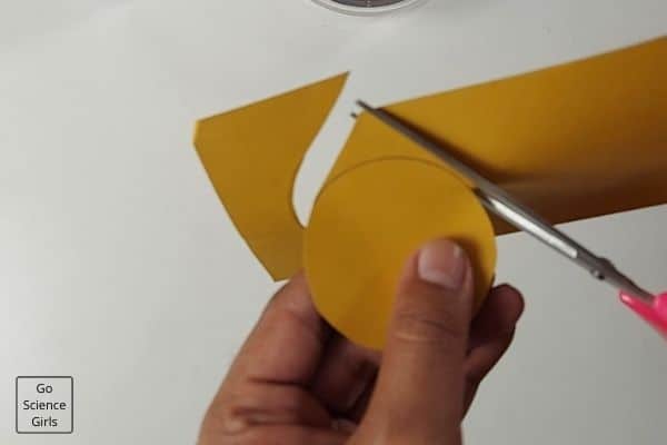 Cut the paper to make compass
